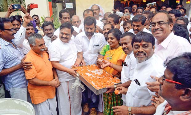 BJP state president Dr Tamilisai Soundararajan and state organising general secretary S. Mohanrajulu distribute sweets at Kamalalayam on Tuesday marked the completion of one year in office of the BJP-led NDA government headed by Modi (Photo: DC) BJP state president Dr Tamilisai Soundararajan and state organising general secretary S. Mohanrajulu distribute sweets at Kamalalayam on Tuesday marked the completion of one year in office of the BJP-led NDA government headed by Modi (Photo: DC)